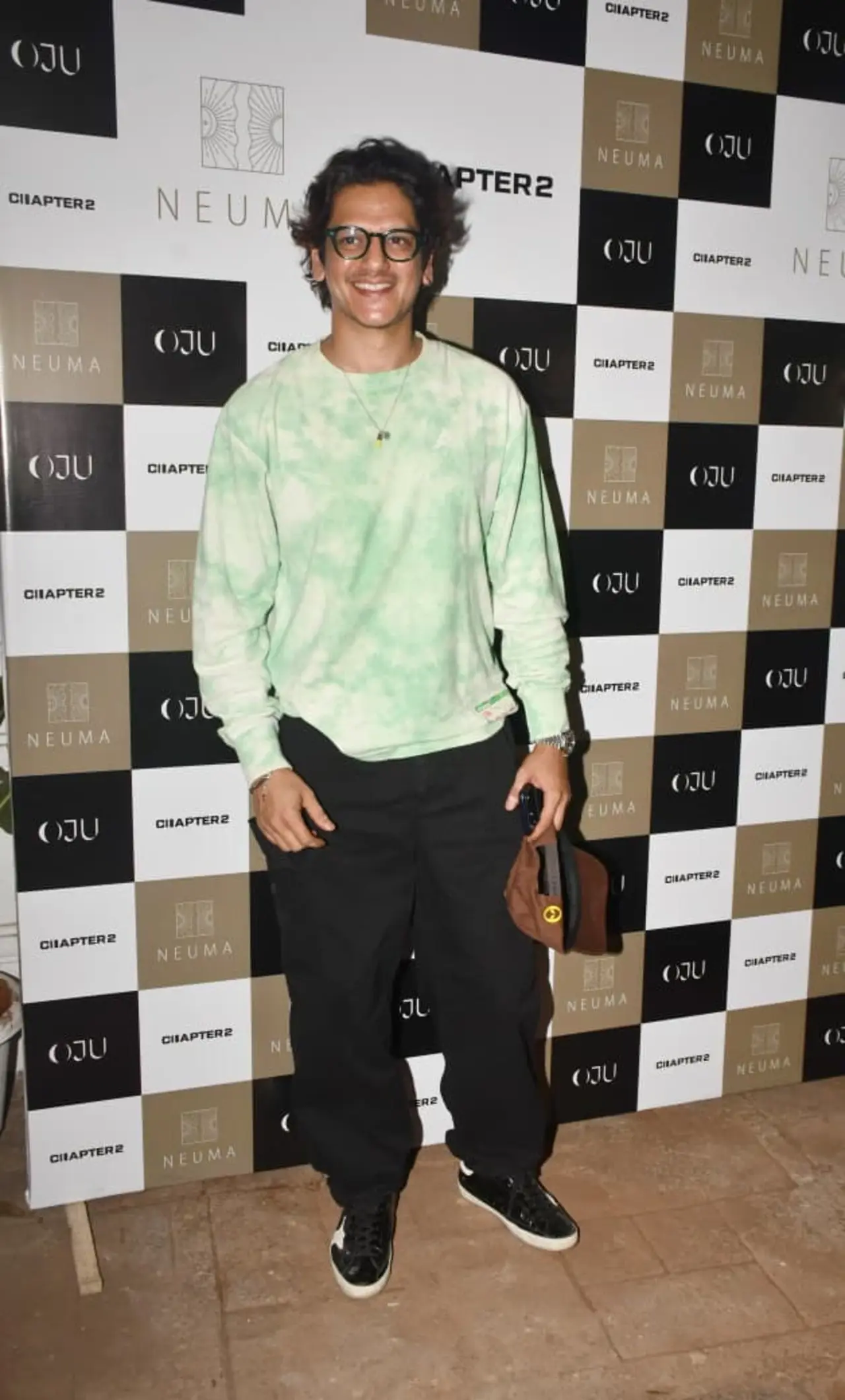 Vijay Varma was spotted at a store launch event in a relaxed and stylish look. The actor wore a green sweatshirt paired with black loose jeans.